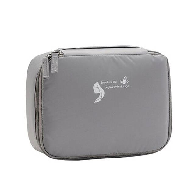 trousse-de-toilette-femme-avec-plusieurs-compartiments-gris-a-vos-trousses Trousse de toilette femme avec plusieurs compartiments gris - À vos trousses