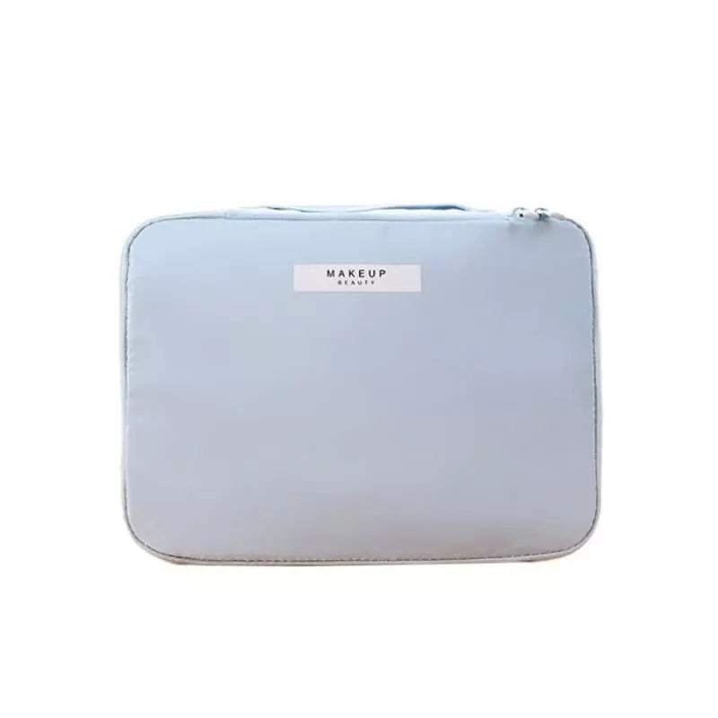 trousse-de-toilette-femme-grand-format-bleu-a-vos-trousses Trousse de toilette femme grand format bleu - À vos trousses