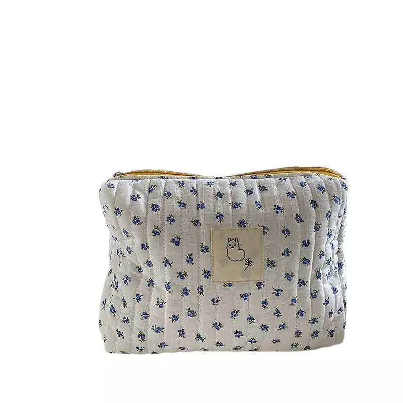trousse-de-toilette-matelassee-bleu-a-vos-trousses Trousse de toilette matelassée bleu - À vos trousses
